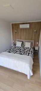 a bedroom with a large bed in a room at Domek na górce u Ani in Polanowo
