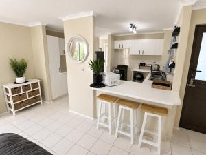 a kitchen with a white counter top in a room at Serengeti Heide Self Catering Flats in Cape Town