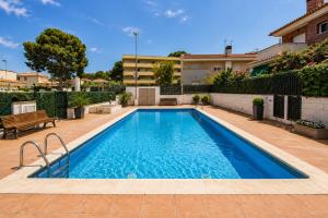 a swimming pool in the backyard of a house at Dream Planetcostadorada in Salou