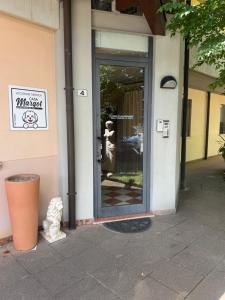 a entrance to a building with a glass door at Casa Margot in Villaverla