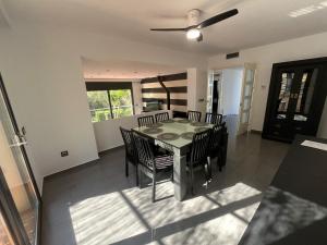 a dining room with a table and chairs at Caribe in Platja d'Aro