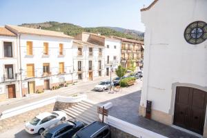 a group of cars parked in front of a building at Casa El Pilar in Serón