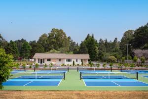 a group of tennis courts in front of a house at Mendocino Cove in Fort Bragg
