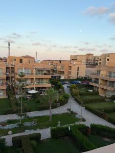 a view of a courtyard in a city with buildings at Studio 3rd Floor Blumar one bedroom in El Alamein