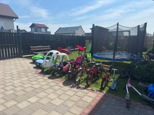 a group of bikes parked in a yard at Tęczowe Lato in Sarbinowo