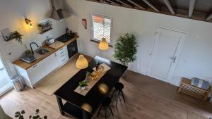 an overhead view of a kitchen with a dining table at Villa Capelinhos in Capelo