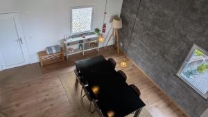 an overhead view of a living room with a table and chairs at Villa Capelinhos in Capelo