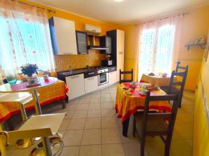 a kitchen and dining room with a table and chairs at B&B Profumo di Zagara in Taormina +31 photos
