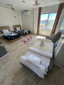 a large living room with a couch and a table at Morsy Palace in Luxor +40 photos