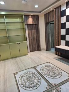a living room with glass doors and a room with rugs at Mavenoak Dreams B&B in Kolkata +50 photos
