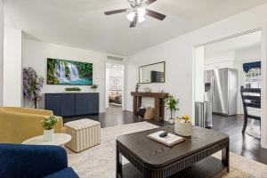 a living room with a couch and a table at Italian Cottage 2B 1B Duplex KING Pet Friendly in Richardson
