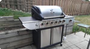 a gas grill with a toaster on top of it at CozyHaven in St. Catharines