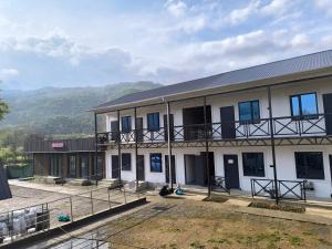 a building with two people sitting outside of it at Амир in Arkit