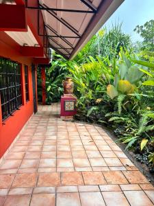 a walkway outside of a house with plants at Serenity Garden Escape in Port-of-Spain