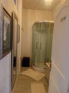 a bathroom with a glass shower and a sink at La Maison de Natasha in Castillon-en-Couserans +48 photos