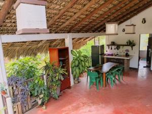 a kitchen with a table and chairs in a room at Casa Tania in Mazunte