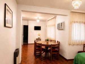 a dining room with a table and chairs at Peatonal Sarmiento in Mendoza