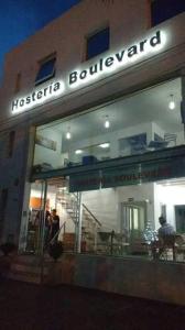 a store front of a building with a sign on it at Hostería Boulevard in Villa María