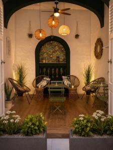 a room with a table and chairs and a painting at Kappuccini Hill boutique hotel - By Tritoni Hotels in Il-Furjana