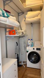 a laundry room with a washing machine and a washer at Bella Vista Città Vecchia in Polignano a Mare +47 photos