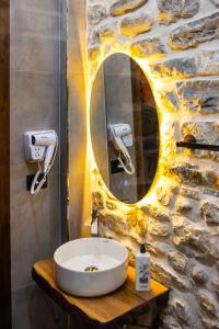 a bathroom with a sink and a mirror at Vila Blin in Berat +103 photos
