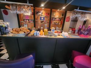 a counter in a restaurant with a plate of bread at La plage - Mauzac in Limoux