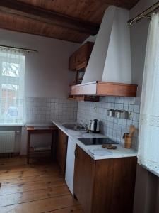 a kitchen with a sink and a counter top at Agroturystyka Folwark in Leszno