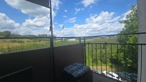 a balcony with a view of a field at InnJoy! in Friedrichshafen