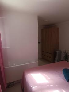 a bedroom with a bed and a bath tub at Maison du Bonheur Chelles in Chelles +7 photos
