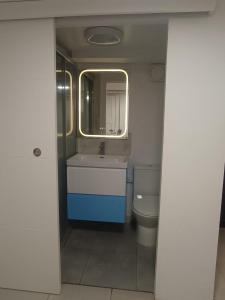 a bathroom with a sink and a toilet at Maison du Bonheur Chelles in Chelles