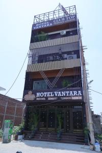 a hotel vattenha building with a sign on it at Hotel Vantara in Karnāl
