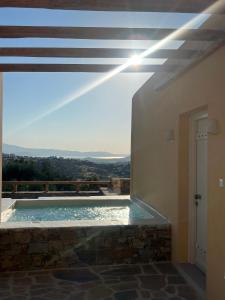 a view of a swimming pool from a house at Pyrgianos Suites - Private Plunge Pool in Naxos Chora