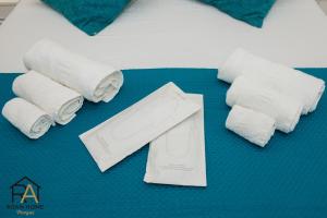 a group of rolls of toilet paper on a table at Roan home Pompei in Pompei +33 photos