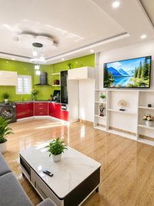a living room with a couch and a table at David Home in Danang