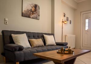 a living room with a couch and a coffee table at Casa Panorama in Igoumenitsa