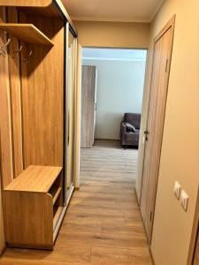 a hallway leading to a room with a closet at Miera osta in Salacgrīva