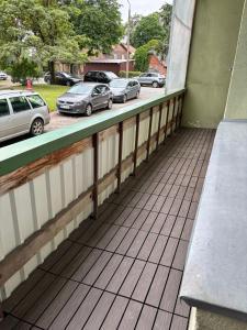 a balcony with cars parked in a parking lot at Miera osta in Salacgrīva