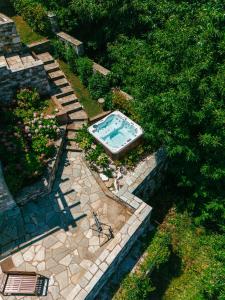 an overhead view of a swimming pool in a garden at A Dream Deferred villa Pelion in Kissos