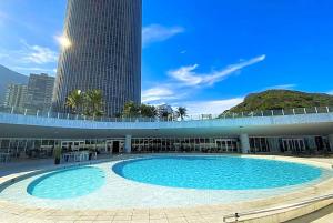 a large swimming pool in front of a building at Hotel Nacional in Rio de Janeiro