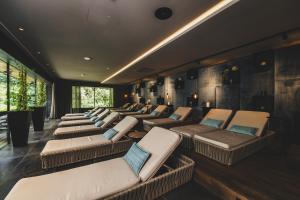 a row of chairs in a waiting room at Hotel Hasenauer 4 Sterne Superior in Saalbach-Hinterglemm