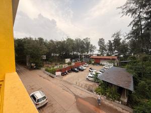 an overhead view of a parking lot with cars parked at Golden rays beach stay in Mangalore