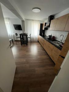 a kitchen with a sink and a table in it at Ferienwohnung zum Kriegerdenkmal in Alzey