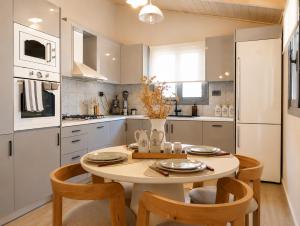 a kitchen with a table and chairs in a kitchen at Luxury casa in Nea Makri