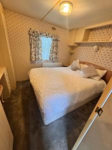 a bedroom with a bed in a small room at No 26 Mountain View in Cockermouth