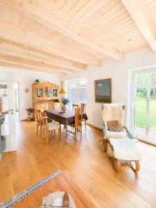 a large living room with a table and chairs at Ferienhaus an der Lohheide in Walsrode