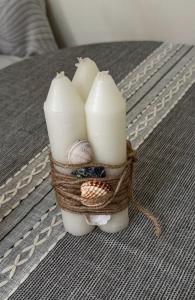 a candle holder with candles on a table at Sisian Sun House in Sisian