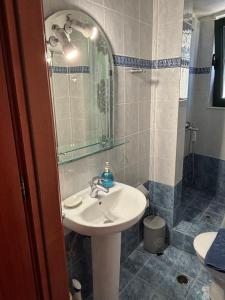 a bathroom with a sink and a mirror at Thetis I in Alexandroupoli