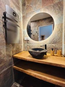 a bathroom with a sink and a mirror at Le cocon d Albi in Albi +14 photos