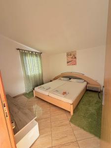 a bedroom with a bed in a room at One floor of house in Bar