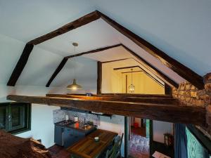 a room with a mirror on the ceiling with a table at Kuća za odmor Odvorci in Jakačina Mala